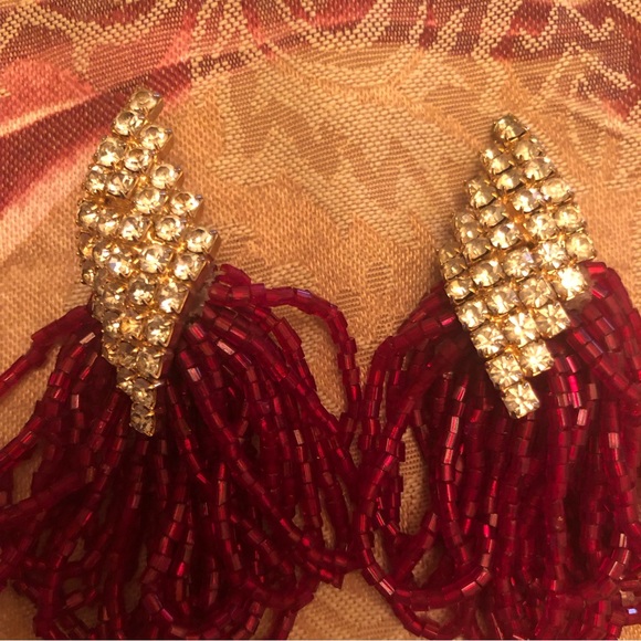 Rhinestone encrusted dangling beads extraordinary clip earrings.